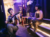 Hadestown co-stars Reeve Carney and Eva Noblezada take a moment backstage.