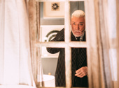 Hadestown Tony nominee Patrick Page checks his reflection before stepping out.